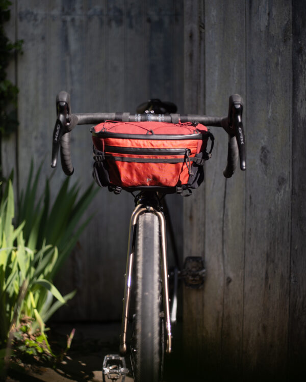 Tilt hip pack, with bike attachment system
